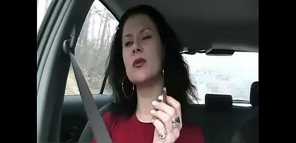  Sexy brunette babe smokes a cigarette